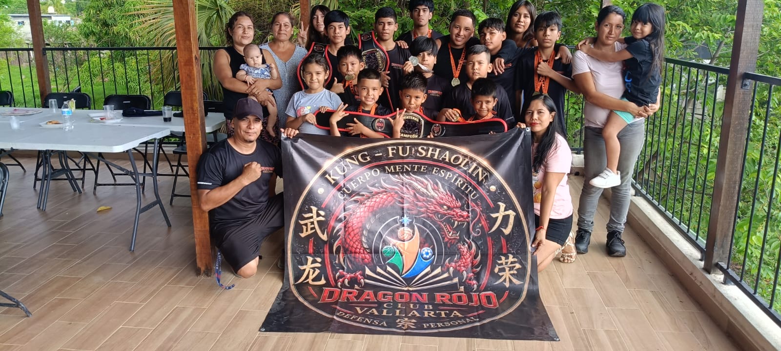 Martial arts students and instructors posing together