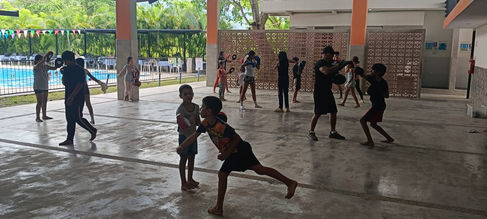 Students practicing martial arts on the court