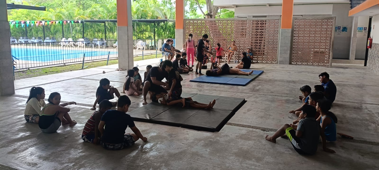 Students exercising on mats